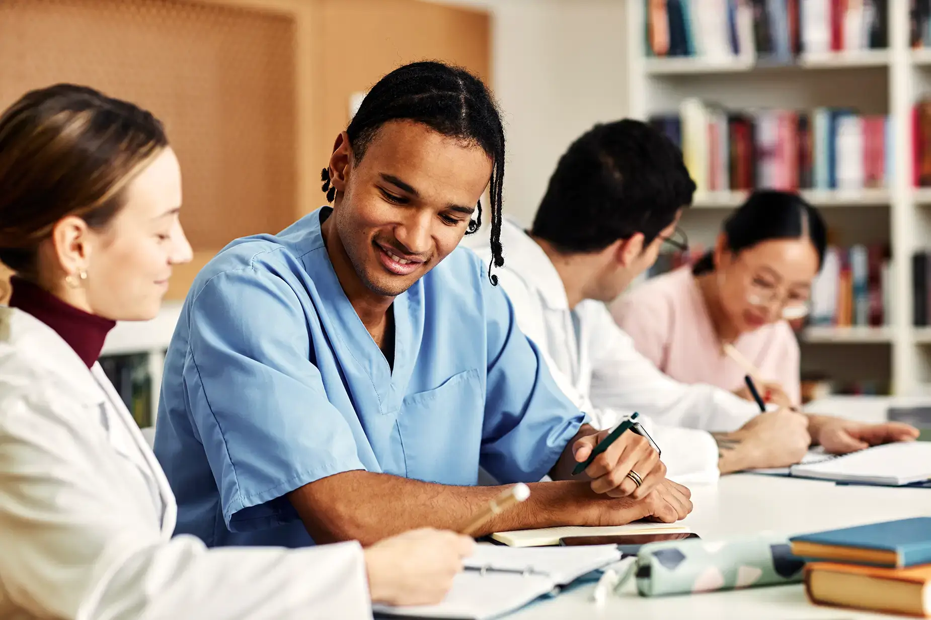 Healthcare students studying at a table